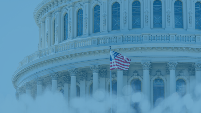 US Congress dome closeup with American flag waving